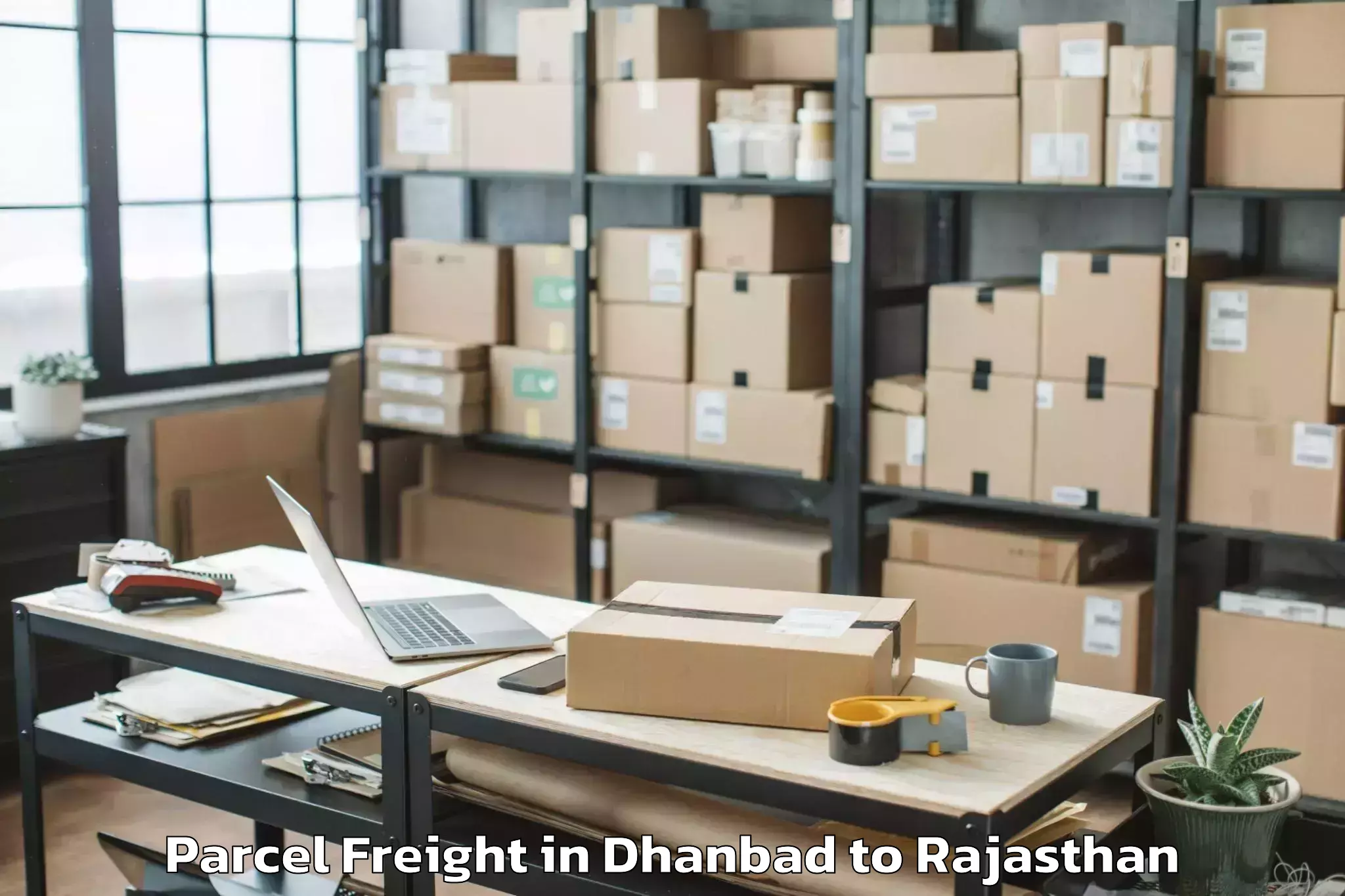 Top Dhanbad to Singhania University Jhunjhunu Parcel Freight Available